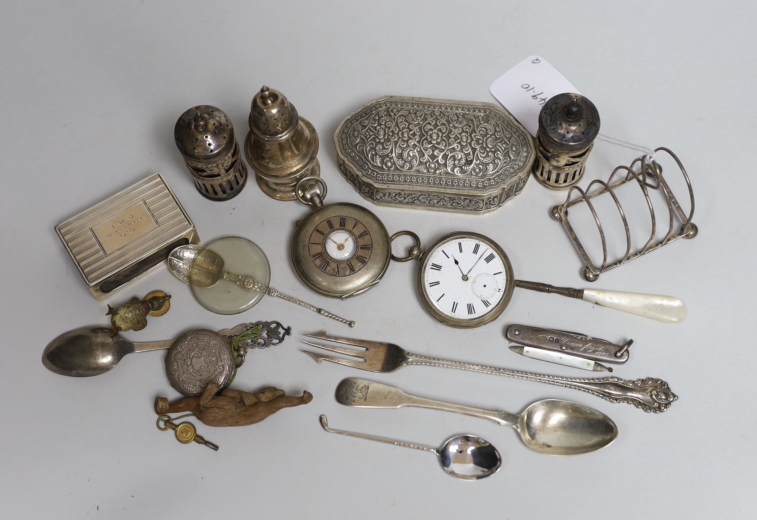 Assorted small silver items including a toastrack, peppers, flatware, mounted penknife, pocket watches, etc. together with a white metal trinket box, plated fork, cold painted bronze duck and a brass cased Hutchinsons Im